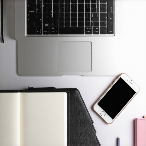 A tidy workspace with a laptop, planner, and smartphone, ideal for managing a travel blog.